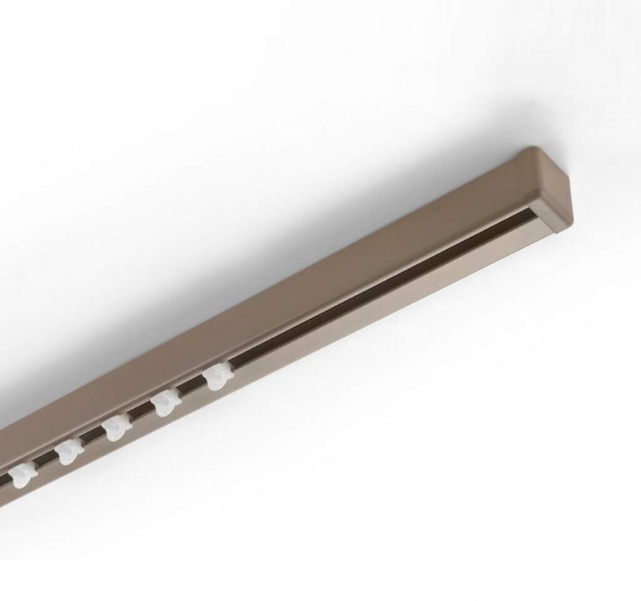 Minimal curtain track integrated into architectural details for custom window coverings