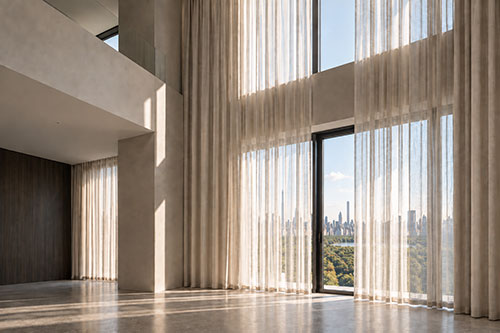 Made-to-measure sheer curtains designed for full-height glazing in a contemporary interior